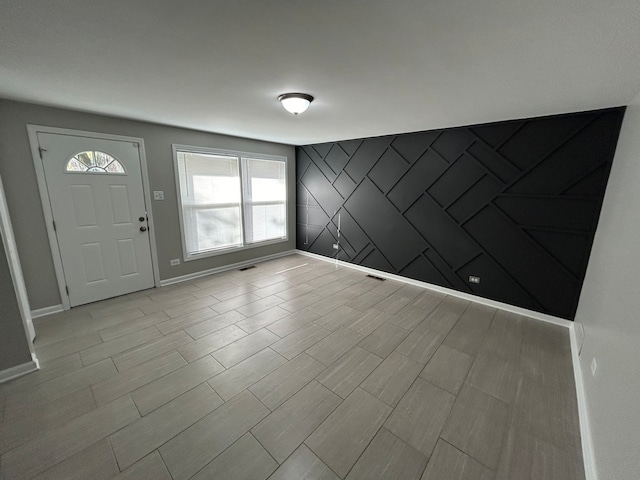 entryway with light hardwood / wood-style floors