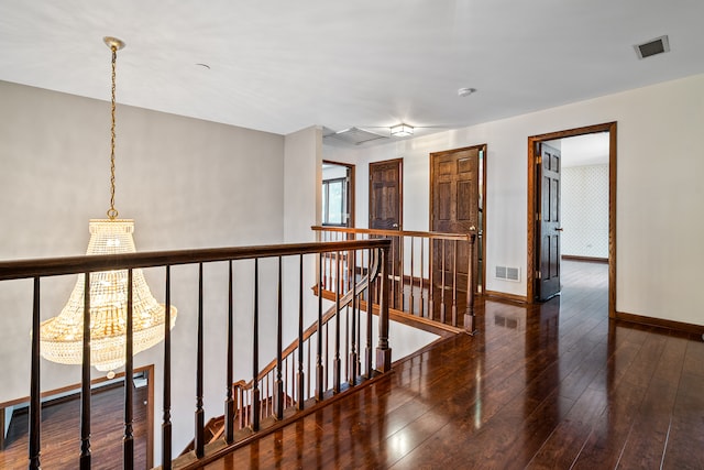 hall with dark wood-type flooring