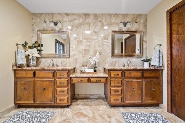 bathroom with tasteful backsplash and vanity