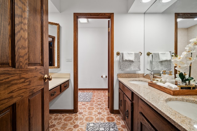 bathroom with tile patterned flooring and vanity