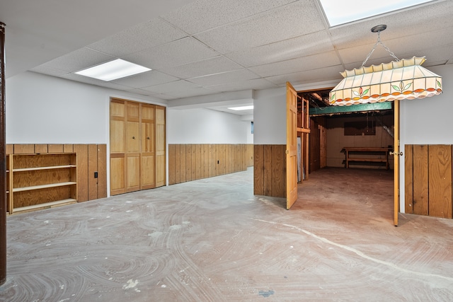 basement featuring a paneled ceiling