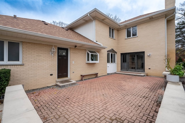 rear view of property featuring a patio