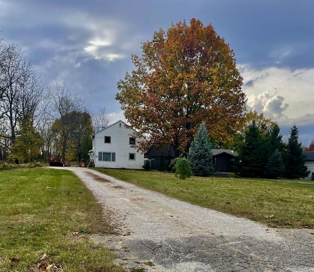 view of side of property featuring a lawn