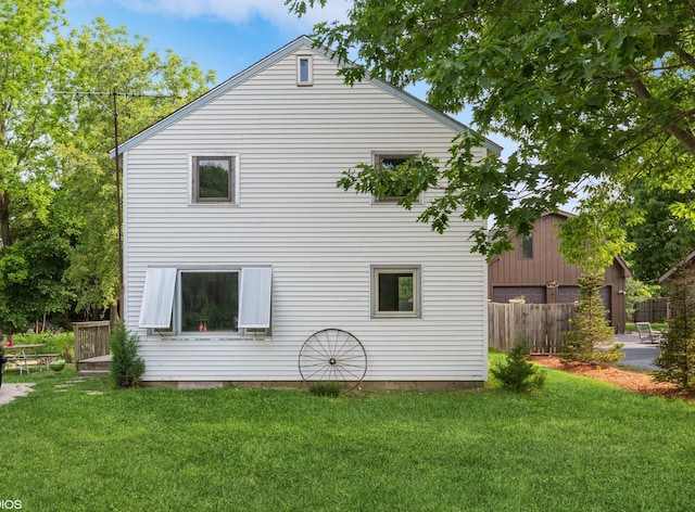 view of side of home featuring a lawn