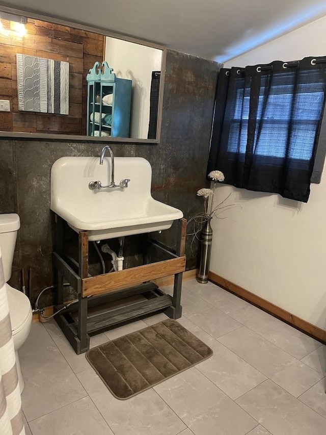 bathroom featuring tile patterned floors, sink, and toilet