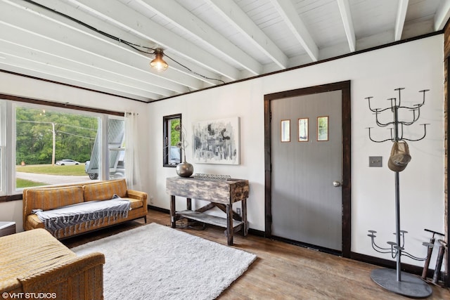 living room featuring beamed ceiling and hardwood / wood-style floors