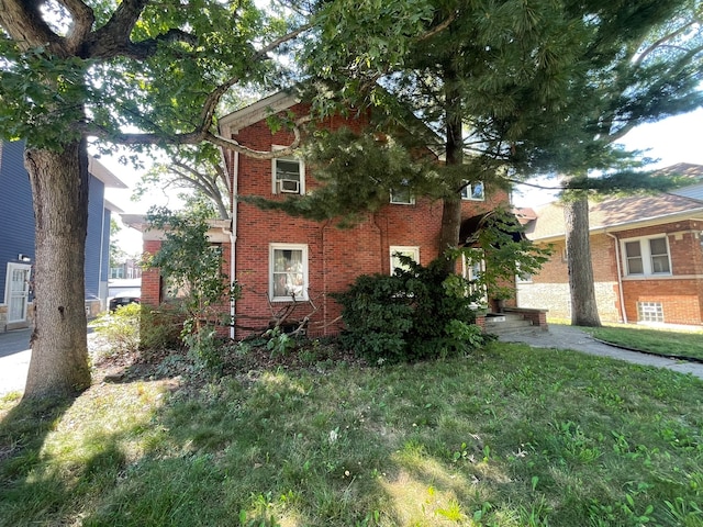 view of home's exterior featuring a lawn