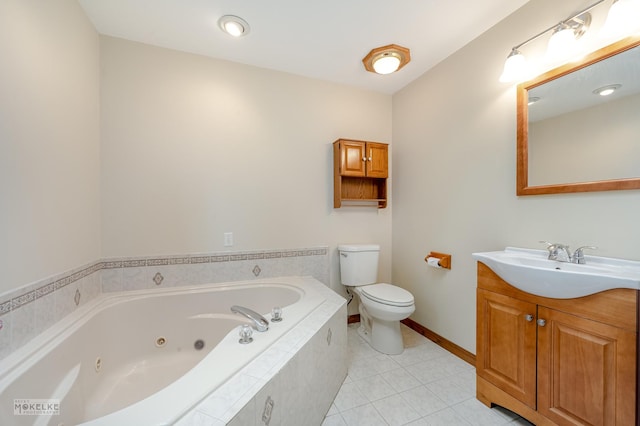 bathroom featuring tile patterned floors, tiled bath, vanity, and toilet