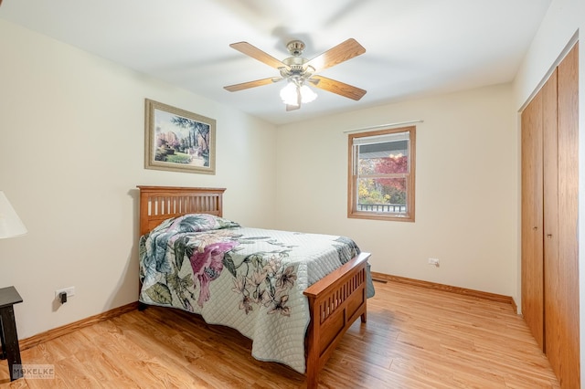 bedroom featuring light hardwood / wood-style flooring, a closet, and ceiling fan