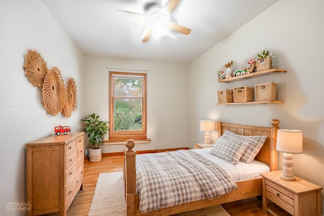 bedroom with ceiling fan and light hardwood / wood-style floors