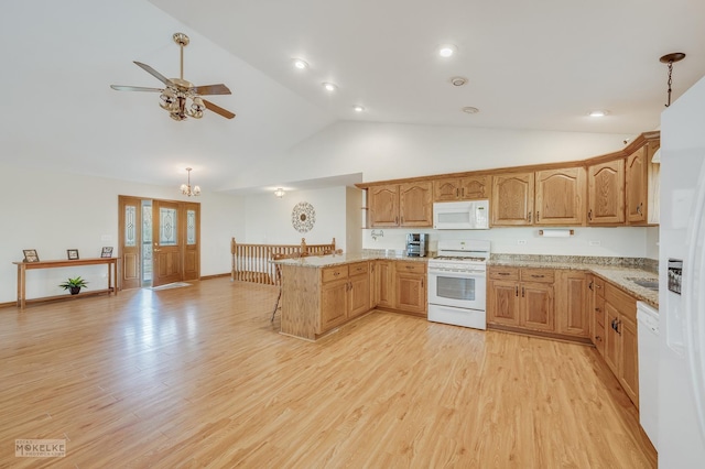 kitchen featuring kitchen peninsula, white appliances, decorative light fixtures, and light hardwood / wood-style floors