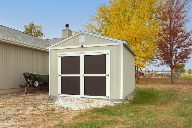 view of outdoor structure with a yard