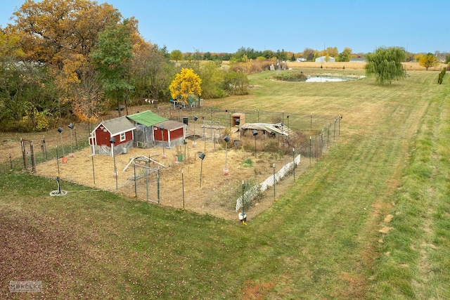 view of yard featuring an outbuilding and a rural view