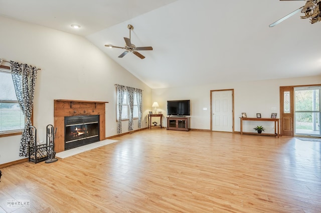 unfurnished living room with ceiling fan, high vaulted ceiling, and light hardwood / wood-style floors