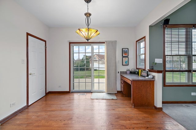 doorway to outside with light hardwood / wood-style floors