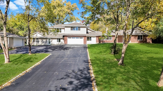 view of front facade with a garage and a front lawn