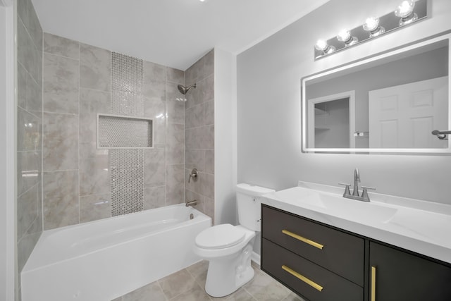 full bathroom with toilet, tiled shower / bath, vanity, and tile patterned floors