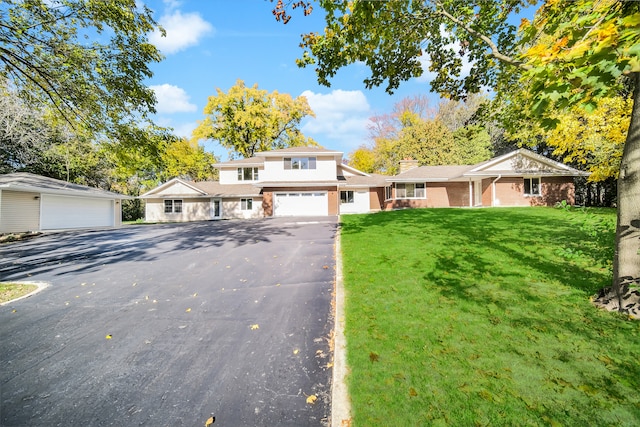 view of front property featuring a front yard and a garage