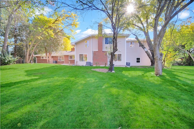 exterior space featuring a yard and central AC unit