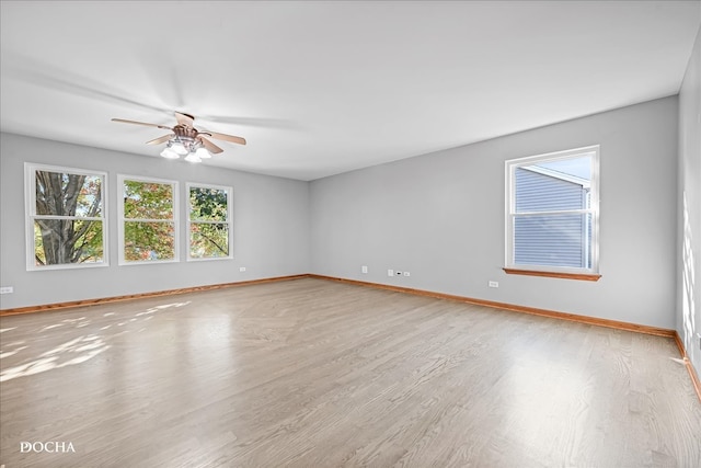 empty room with light wood-type flooring and ceiling fan