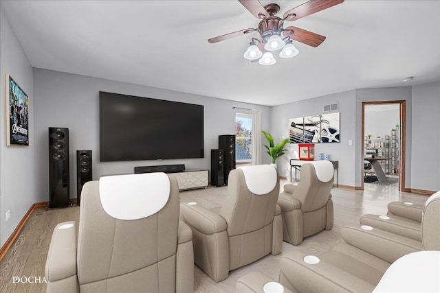 living room featuring light hardwood / wood-style flooring and ceiling fan