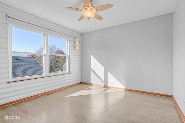 unfurnished room with light hardwood / wood-style floors and ceiling fan