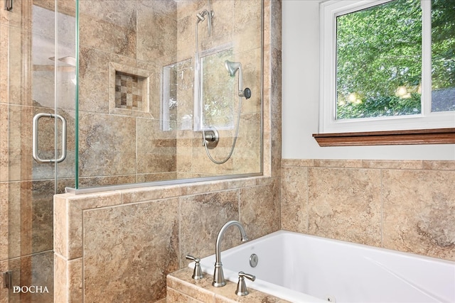 bathroom with shower with separate bathtub