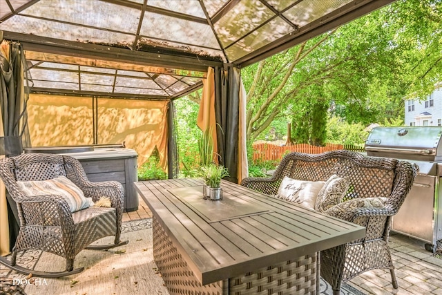 sunroom / solarium with a jacuzzi