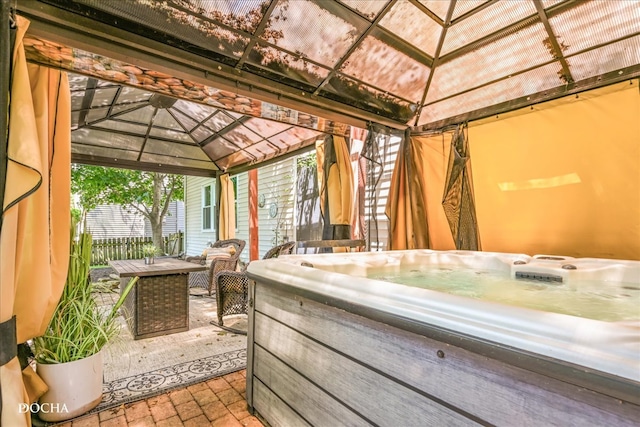 view of patio featuring a gazebo and a hot tub