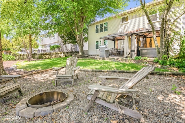 rear view of house featuring an outdoor fire pit, a patio area, and a pergola