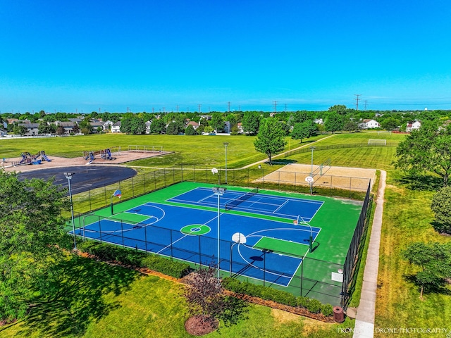 view of basketball court featuring a yard