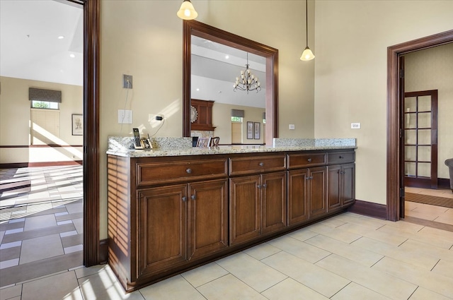 bathroom featuring vanity and a notable chandelier