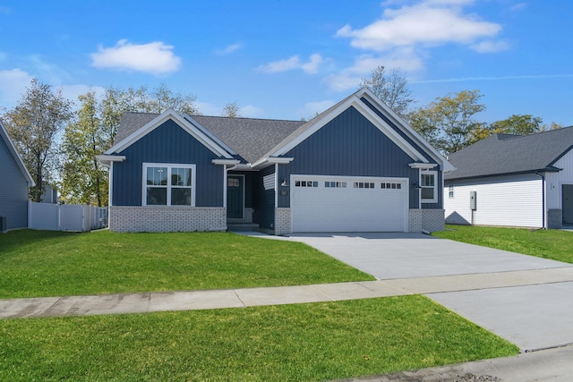 view of front of property with a front yard and a garage