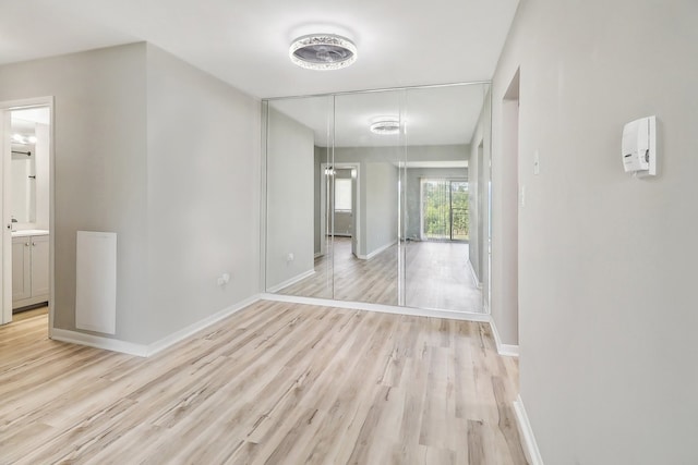 empty room with light hardwood / wood-style floors