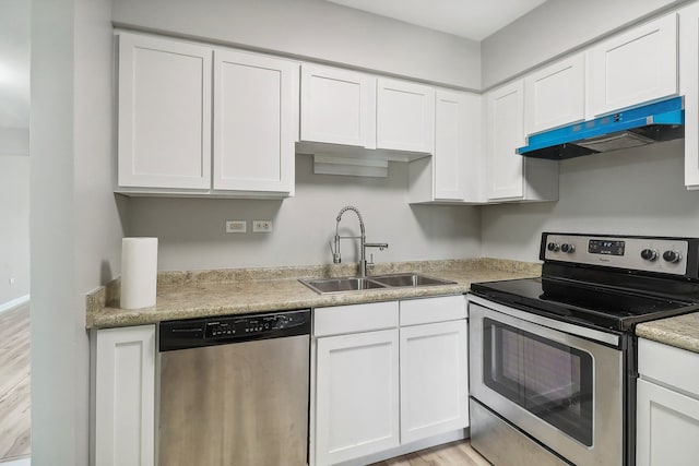 kitchen featuring sink, white cabinets, and stainless steel appliances