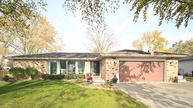 single story home with a front yard and a garage