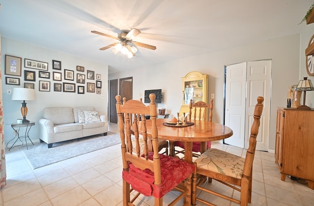 dining room with ceiling fan and light tile patterned floors