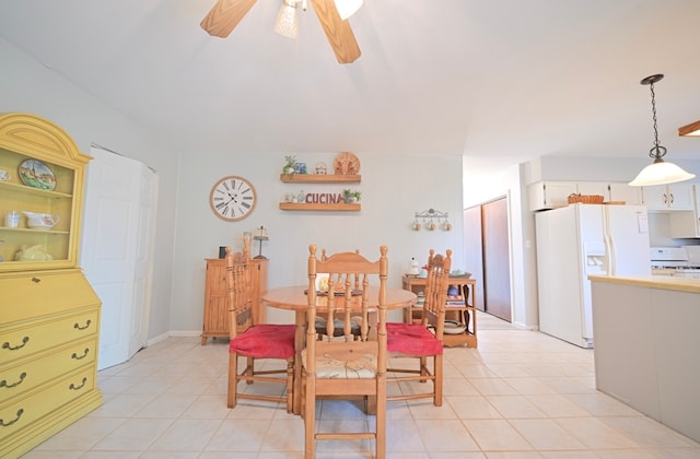 tiled dining area with ceiling fan