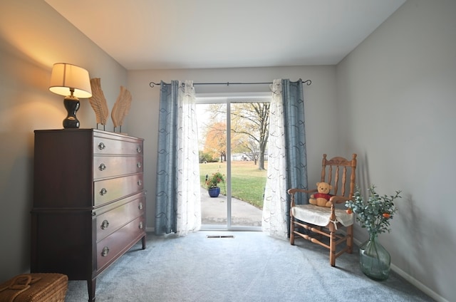 living area featuring carpet