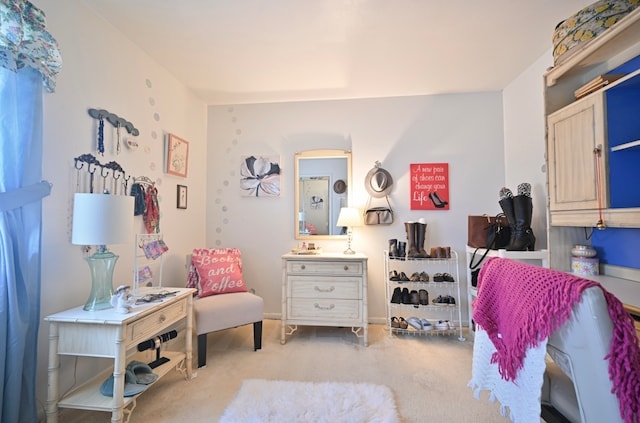 bedroom featuring light colored carpet