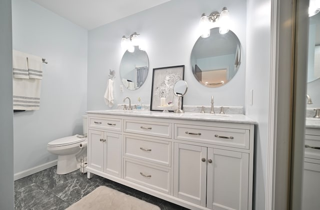 bathroom with vanity and toilet