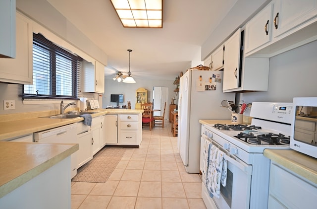 kitchen featuring white cabinets, white appliances, and light tile patterned flooring