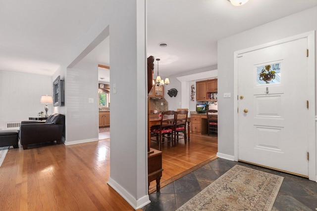 foyer featuring an inviting chandelier