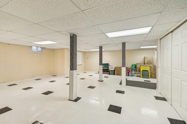 basement featuring a drop ceiling