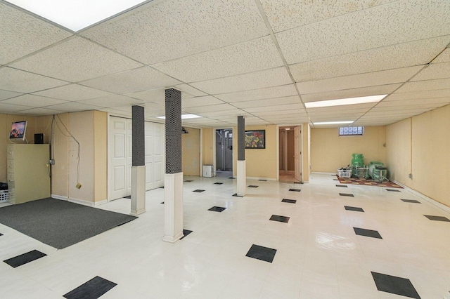 basement featuring a drop ceiling