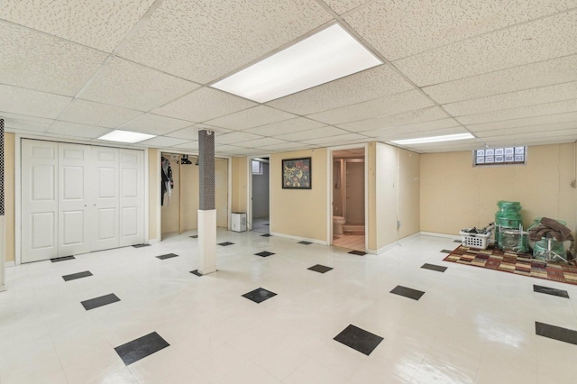 basement featuring a drop ceiling