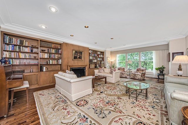 living room with ornamental molding and hardwood / wood-style flooring