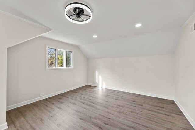 bonus room featuring lofted ceiling, hardwood / wood-style floors, and ceiling fan