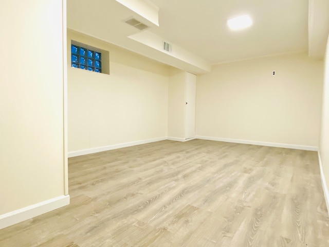 spare room featuring light hardwood / wood-style flooring