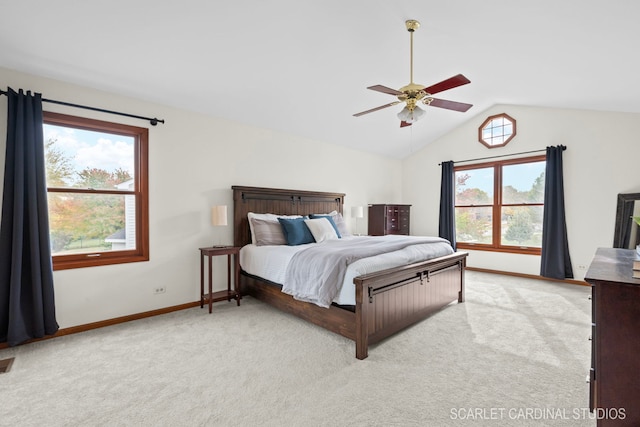 carpeted bedroom featuring ceiling fan, lofted ceiling, and multiple windows